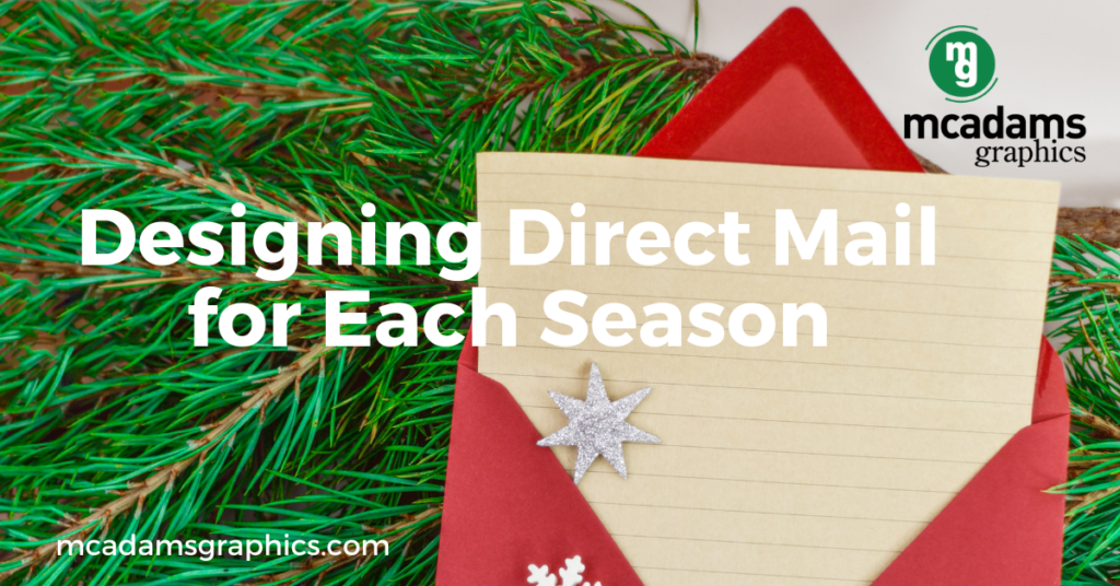 Pine branches and a holiday card for seasonal direct mail marketing