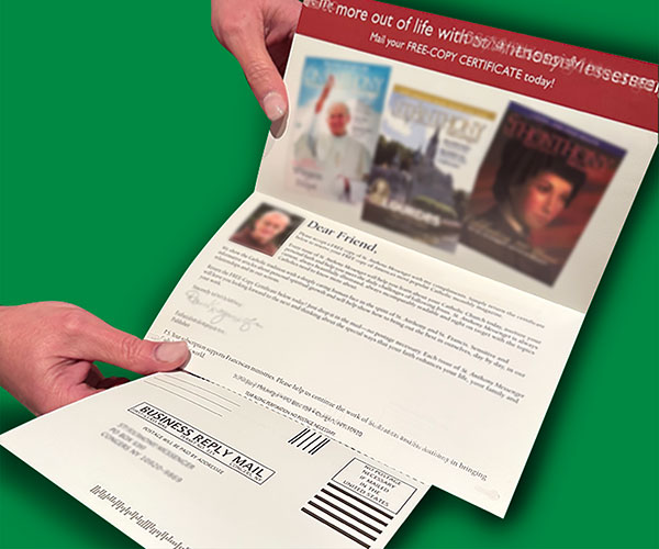 An example postcard self mailer is displayed. It is open so one can see where the recipient would detach the post card to complete and return to the sender.